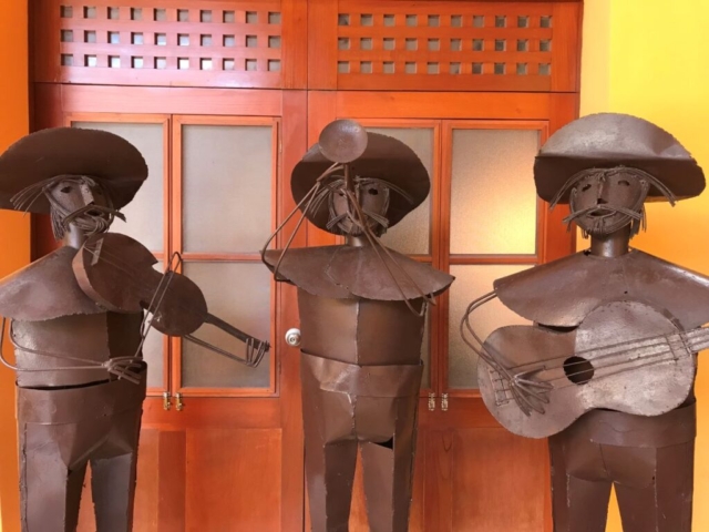 metal sculptures depicting mariachi band
