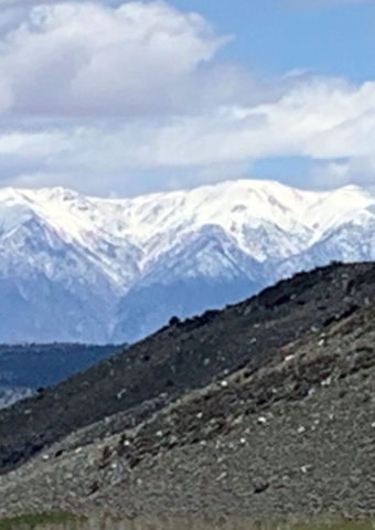 Eerie image of mountains in distance rough terrain in foreground
