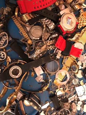 Miscellaneous watch parts in a pile